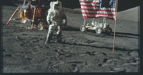 Astronaut Jack Schmitt Poses With The American Flag While On Eva During