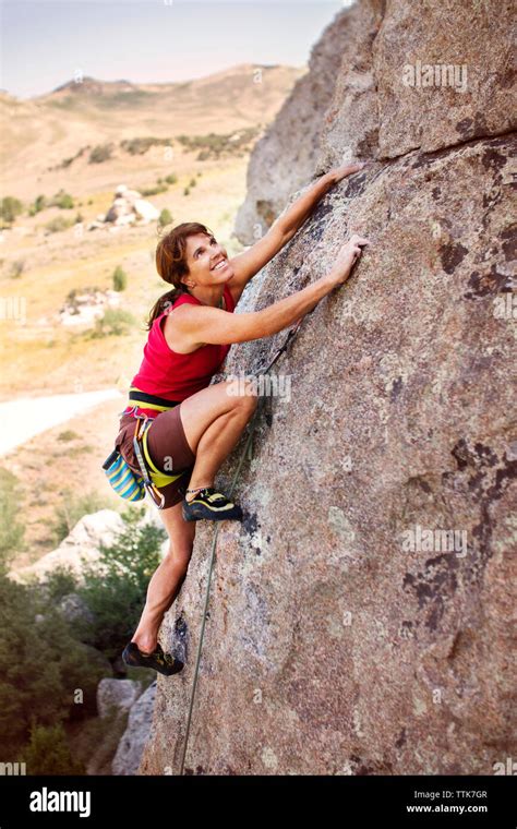 Female Climber Climbing Mountain Stock Photo Alamy