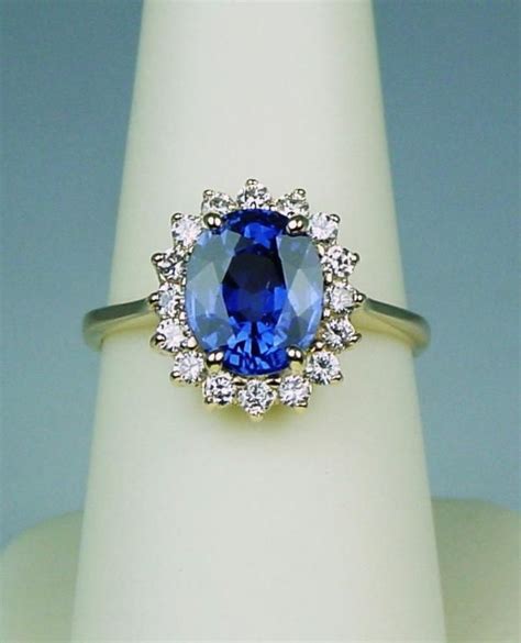 Featuring a magnificently large aquamarine stone, this timeless cocktail ring is inspired by the impeccable fashion style of one of the most prominent women. Gorgeous 18K YG Ladies "Princess Diana" Style Ring