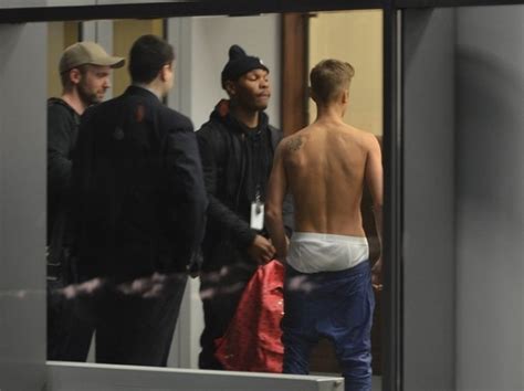 I Am Fake Beliebers Justin Bieber Shirtless At Passport Check In Lodz