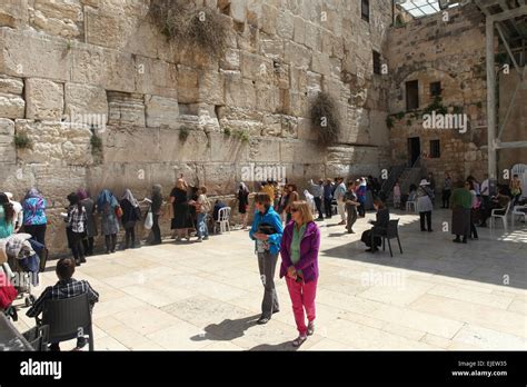 Women And Tourists Pray At The Western Walls Womens Section The