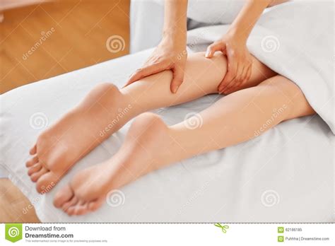 Young Woman Receiving Leg Massage At Spa Center Body Care Stock Image