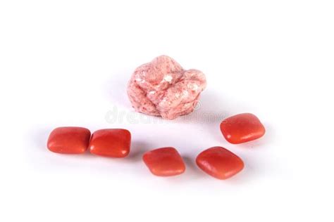 Whole Pieces And Chewed Red Bubble Gum Isolated Over White Stock Photo