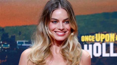 Margot Robbie Is A Bombshell In Low Cut Jacquemus As She Promotes Once