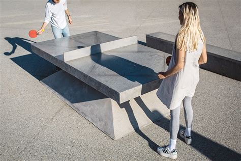 Smooth gray overlay, coffee brown acid stain and dci water based sealer. Monoliths: Concrete Ping Pong Tables & Benches