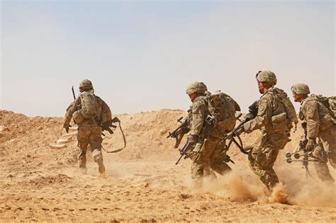 Soldiers Rush To Secure A Fighting Position During Live Fire Training