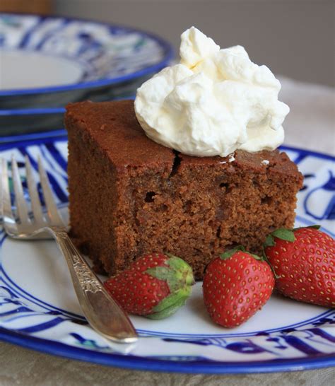 Garnished with chocolate ganache and berries. Soaked ginger cake with brown sugar sauce for your ...