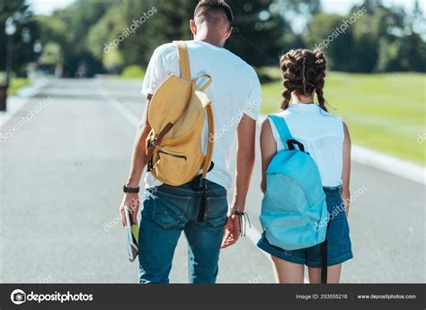 Back View Teenage Boy Girl Backpacks Walking Together Park Stock Photo