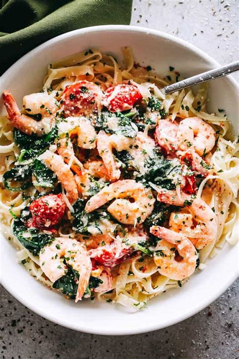 creamy shrimp fettuccine with spinach and tomatoes recipe for a quick and delicious weeknight