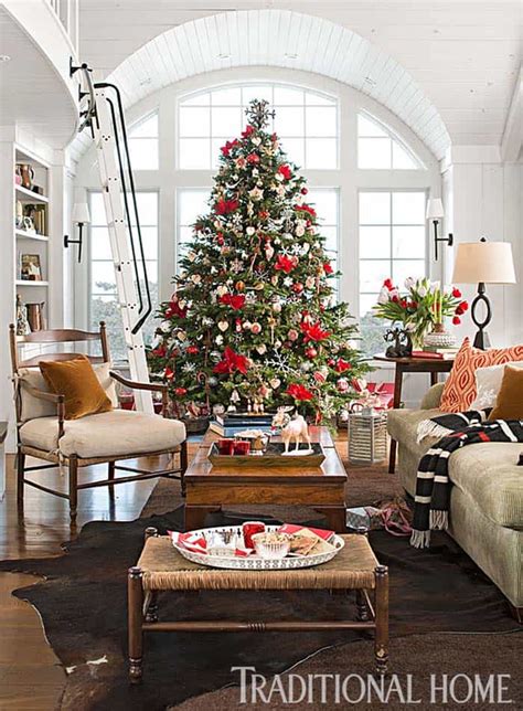 Decorating for christmas is a big business. Inviting Christmas decorated stone cottage in New England
