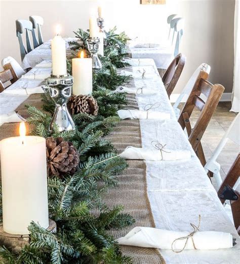 A Burlap Table Runner An Evergreen Garland Candles And Large