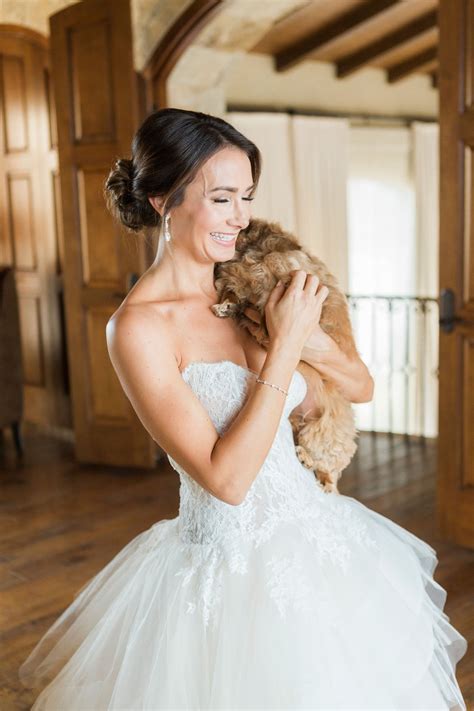 Bride Holding Her Dog Before Wedding