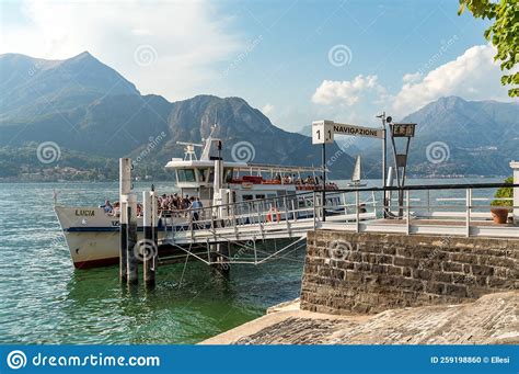 The Ferry Boat With Tourists At The Pier Of Picturesque Village