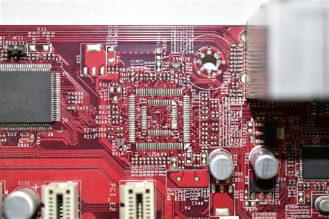 Red Computer Motherboard Chip Close Up With Elements Stock Photo