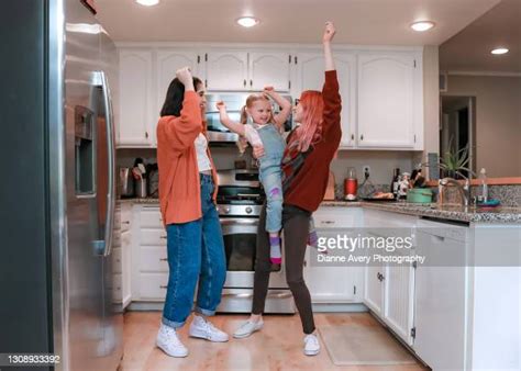 Lesbian Moms Daughter Hang Out In The Kitchen Photos And Premium High