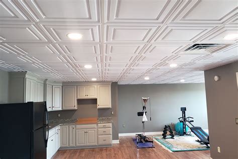 Installing a drop ceiling allows a homeowner to cover up higher ceilings that have an unpleasant look. Stratford | Vinyl Ceiling Tiles | White 2x4 Ceiling Tiles