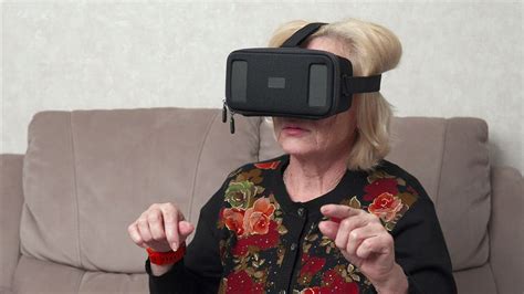 Elderly person using a VR headset - Free Stock Video