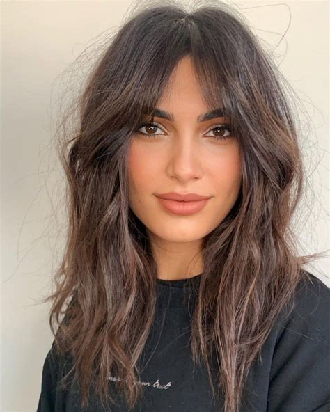 oval face and long messy hair layered haircuts with bangs side bangs hairstyles oval face
