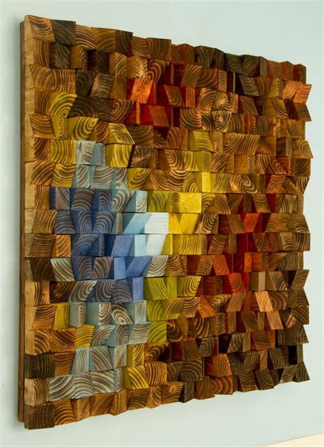 An Art Piece Made Out Of Wood With Different Colors On The Wall And In