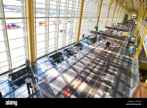 Passengers Walk Through The Airport Terminal At Ronald Reagan