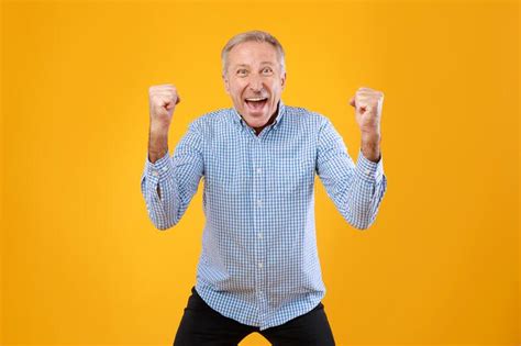 portrait of excited mature man screaming with raised fists stock image image of yelling