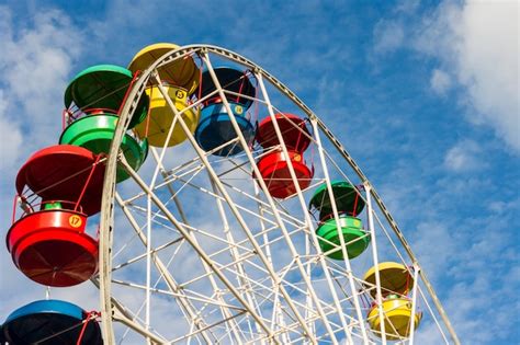 Premium Photo A Colored Ferris Wheel In A Children Park