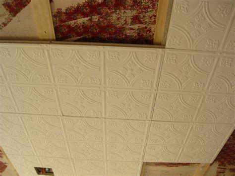 Damaged ceiling tiles from water, gouging or other mishaps make for an unsightly room. ANNE-VILLE: How to install ceiling tiles