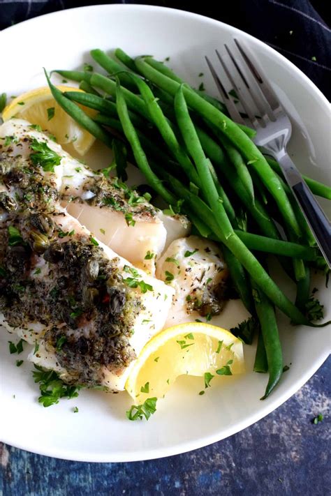 In a small bowl or measuring cup, combine melted butter, olive oil, garlic, paprika, and curry powder and whisk to combine. Baked Cod Fish with Lemon and Capers - Lord Byron's Kitchen