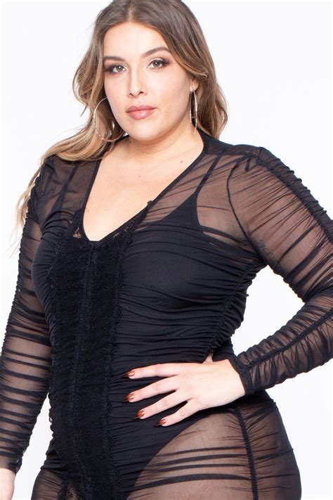 this plus size sheer mesh knit mini dress features a ruched design throughout a plunging