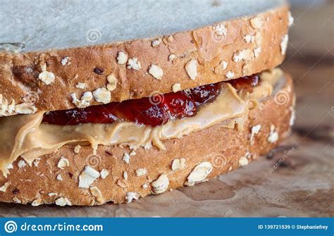 Peanut Butter And Strawberry Jelly Sandwich Close Up Stock Image
