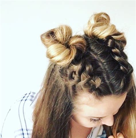 Braids are funky, buns are classic, and the combination of the two is sheer perfection. Double Dutch Braid Buns Half-up Hairstyle - Cassie Scroggins