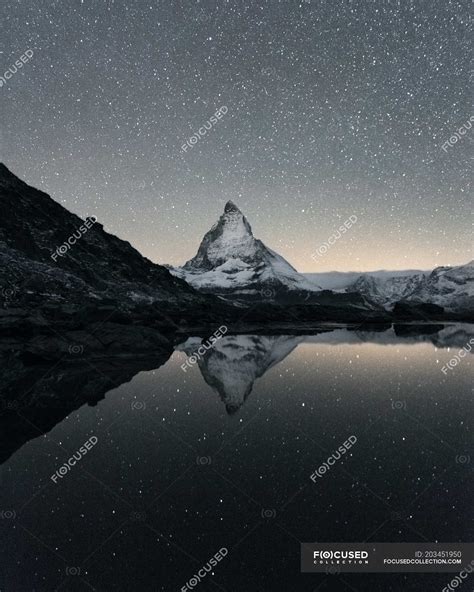 Matterhorn Reflecting Over Lake Riffelsee At Night Zermatt Valais Switzerland Alps Galaxy