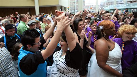 gay and lesbian couples celebrate at mass wedding at cleveland s galleria