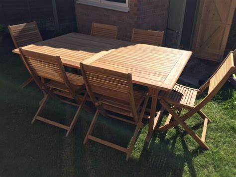 Wooden garden tables need a bit of maintenance to stay fresh. Roscana Teak Wooden Outdoor 6 Seater Extending Dining Set ...