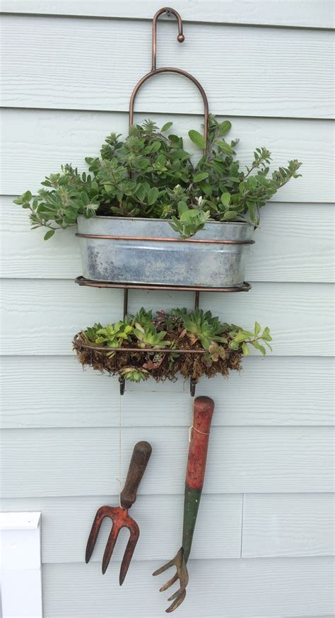 Looks just like the picture. Simple wall-hanging planter created from recycled shower ...