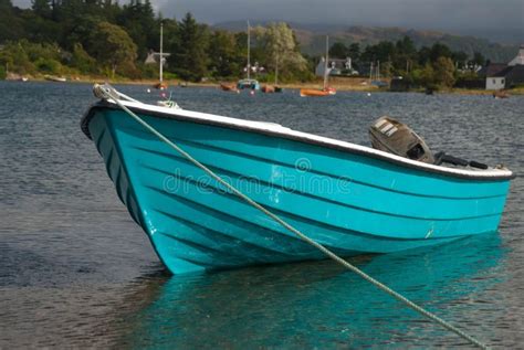 Blue Boat Peacefully Floating In The Lake In Spring Stock Photo Image