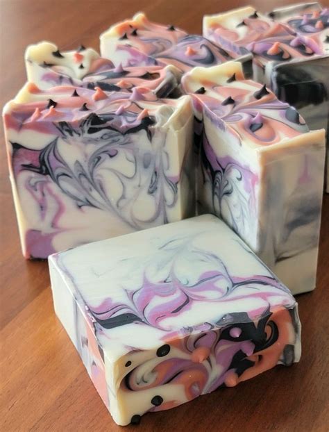 Soap Bars With Different Colors And Shapes On A Wooden Table