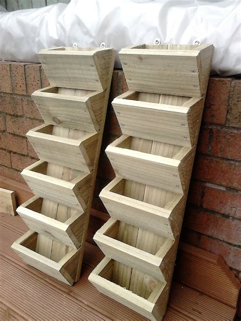 Rated 4 out of 5 by gardener l from 3 tier hanging planters these look great hanging on my fence but i wish the slot was an inch biggger on both sides to be able to plant more flowers. Pin by Adrienne Sharma on Herb garden wall in 2020 (With ...