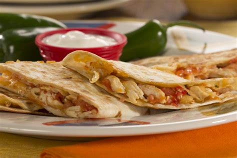 Incredible chicken quesadillas are packed with juicy chicken, peppers, onions, garlic, and lots of melty cheese. Cheesy Chicken Quesadillas | EverydayDiabeticRecipes.com