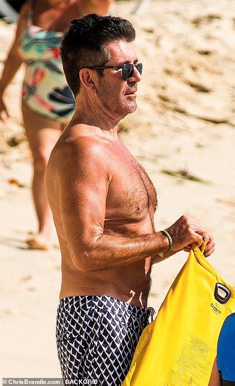 simon cowell looks on fine form as continues to showcase his newly slimmed down physique in