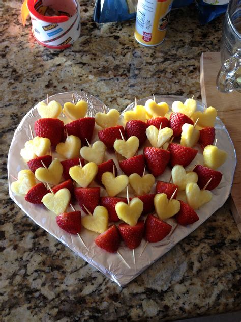Strawberries And Apples Arranged In The Shape Of Hearts On A Heart