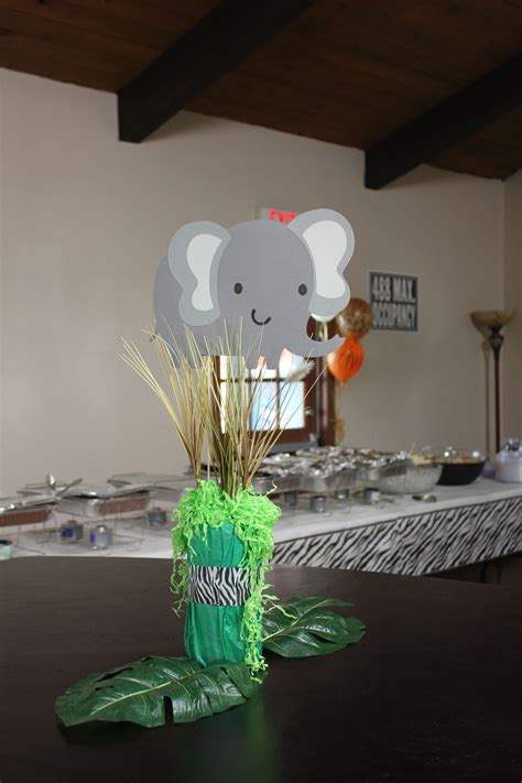 Hanging palm tree garlands around the venue is a great way to set the safari tone. Baby Shower Safari theme I did using the cricut | Safari ...