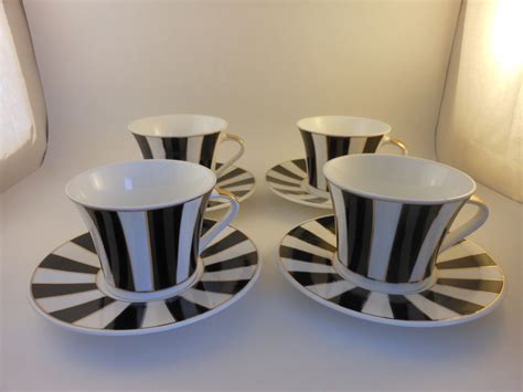 Set Of 4 Petite Coffee Cups And Saucers They Are Black And White