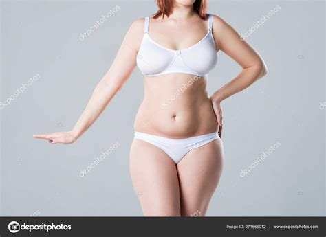 Woman With Fat Flabby Belly Overweight Female Body On Gray Background
