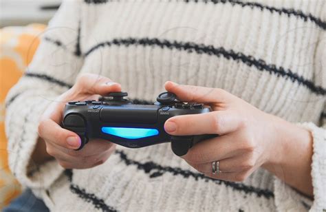Person Holding Gaming Controller Playing Video Games Gamer