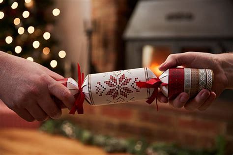 Christmas crackers are usually made with cardboard tubes, tissue paper, wrapping paper, and plastic. Christmas Cracker Pictures, Images and Stock Photos - iStock
