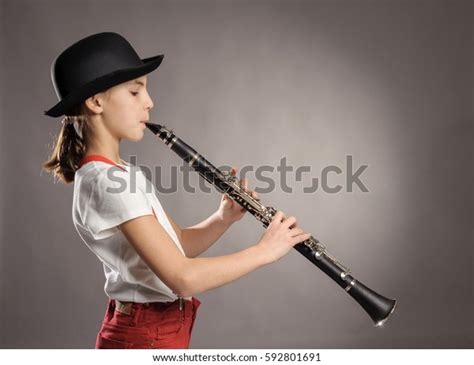 Little Girl Playing Clarinet On Gray Stock Photo Edit Now 592801691