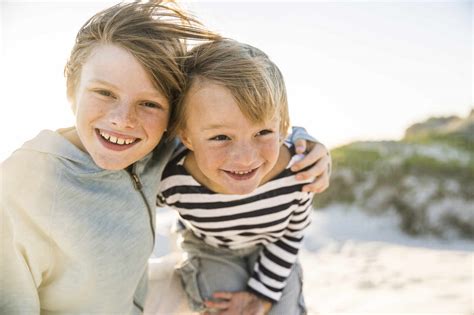 Portrait Of Two Happy Boys On The Beach Stock Photo