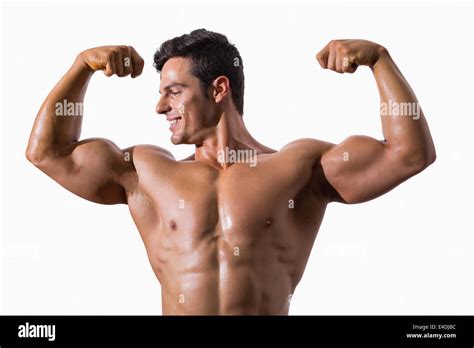 Portrait Of A Muscular Young Man Flexing Muscles Stock Photo Alamy