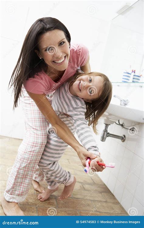 Mother And Daughter Having Fun In Bathroom Brushing Teeth Stock Image Image Of Happy Daughter